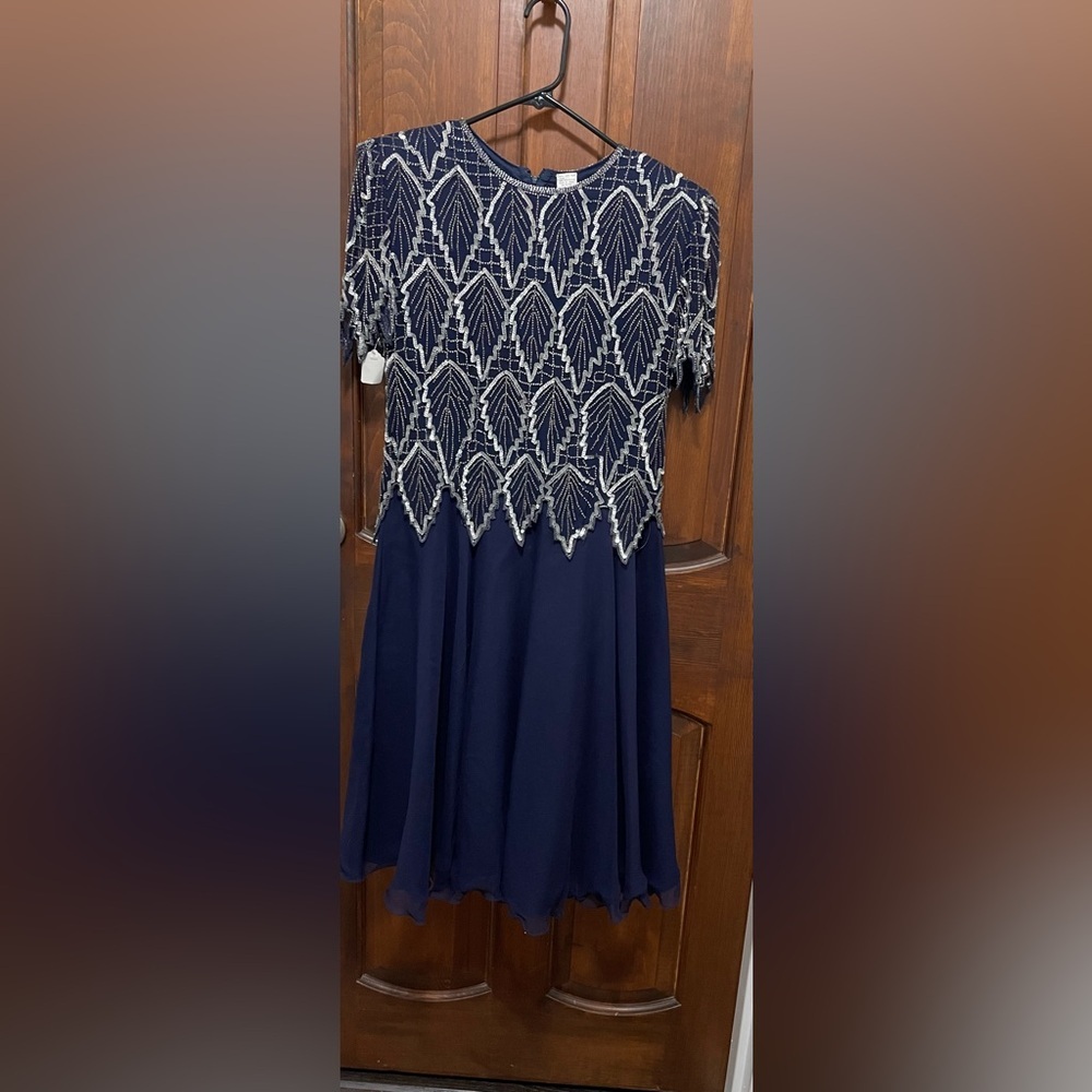 Women’s size small P Navy blue 100% Silk evening dress. Heavily beaded, sequins